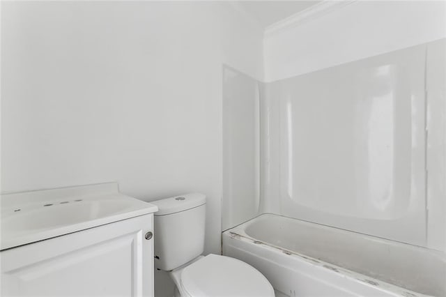 full bathroom featuring ornamental molding, vanity, tub / shower combination, and toilet