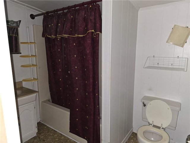 bathroom featuring toilet, shower / bath combo with shower curtain, crown molding, and wooden walls