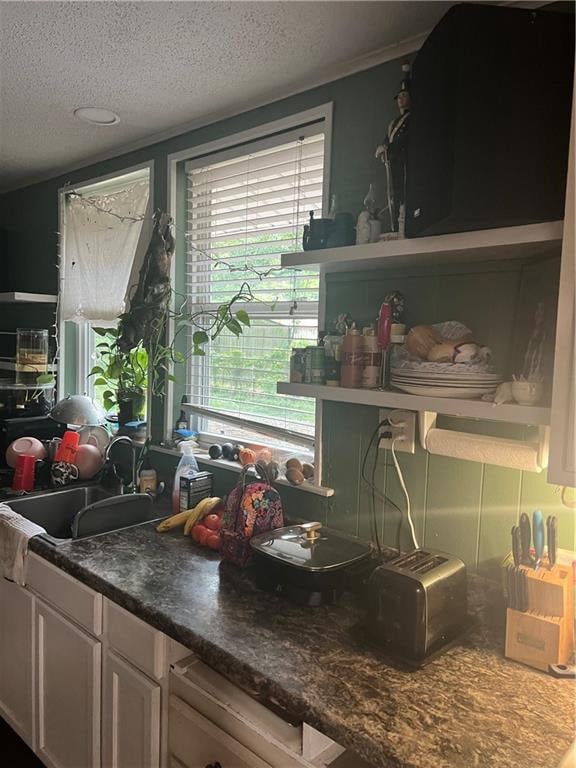 kitchen featuring sink and a textured ceiling