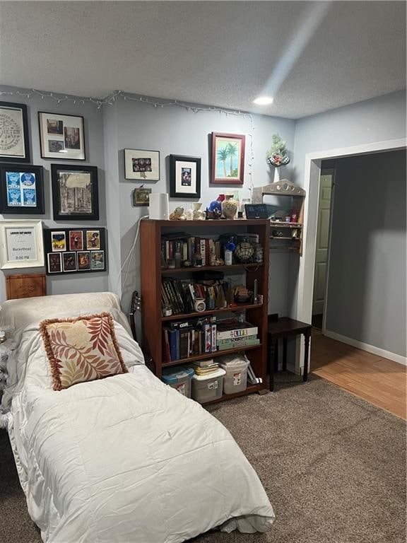 carpeted bedroom with a textured ceiling