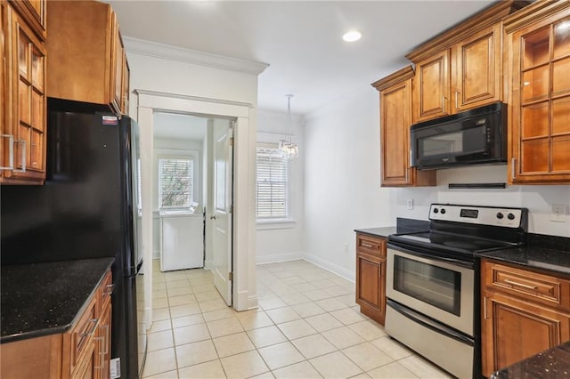 kitchen featuring dark stone counters, an inviting chandelier, black appliances, crown molding, and hanging light fixtures