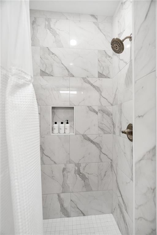 bathroom with a shower with shower curtain