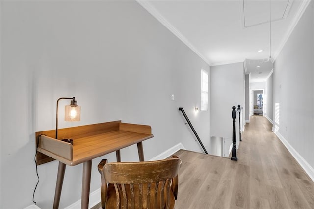 hallway featuring light wood-type flooring and ornamental molding