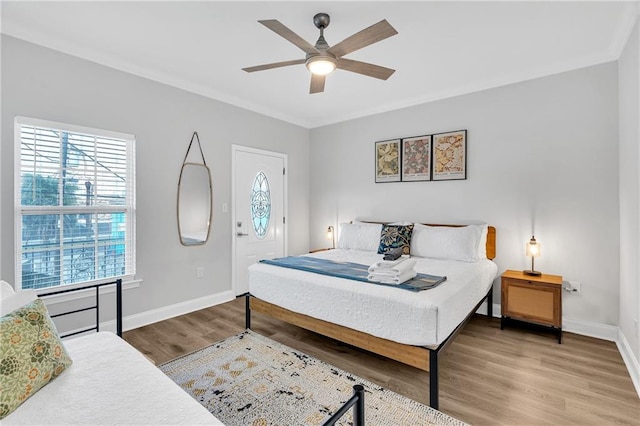 bedroom with ceiling fan and wood-type flooring