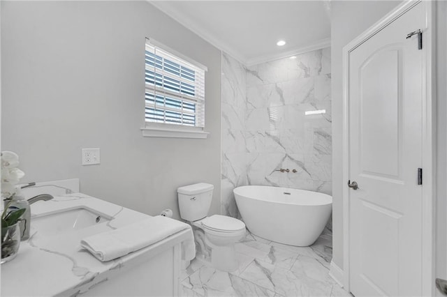 bathroom with vanity, toilet, ornamental molding, and a bath