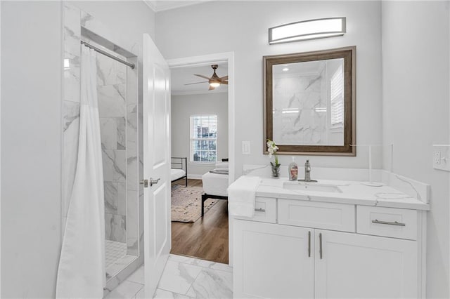 bathroom with hardwood / wood-style flooring, ceiling fan, curtained shower, and vanity