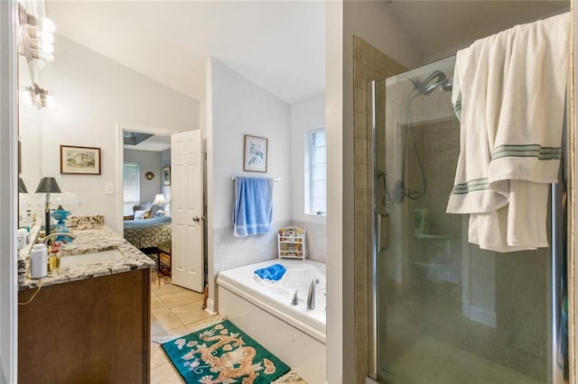 bathroom with tile patterned floors, vanity, vaulted ceiling, and shower with separate bathtub