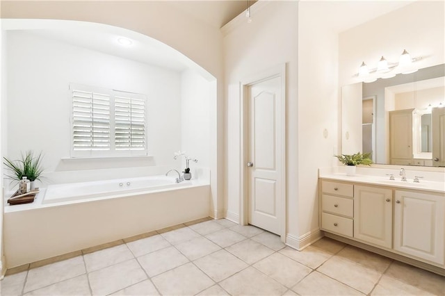 bathroom with vanity, a bath, and tile patterned floors