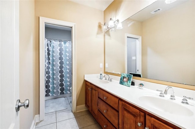 bathroom with vanity and tile patterned floors