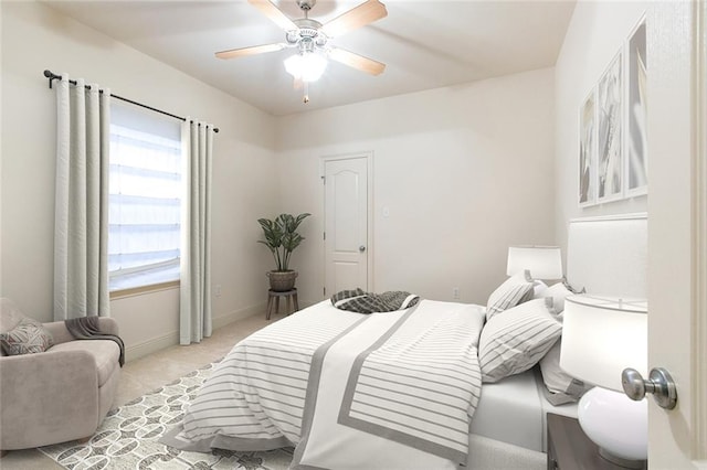 bedroom with light colored carpet and ceiling fan