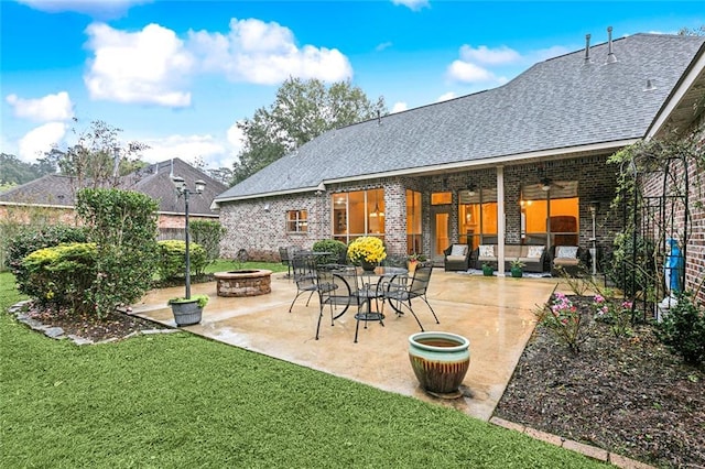 view of patio with a fire pit