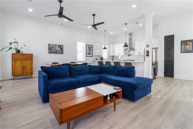 1201 Louisa St, New Orleans, LA 70117 - living area featuring a ceiling fan, light wood-style flooring, ornamental molding, recessed lighting, and baseboards