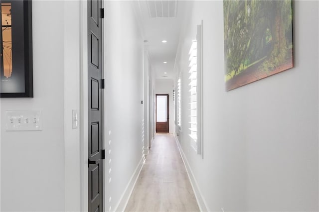 1201 Louisa St, New Orleans, LA 70117 - hall featuring light wood finished floors, baseboards, and recessed lighting