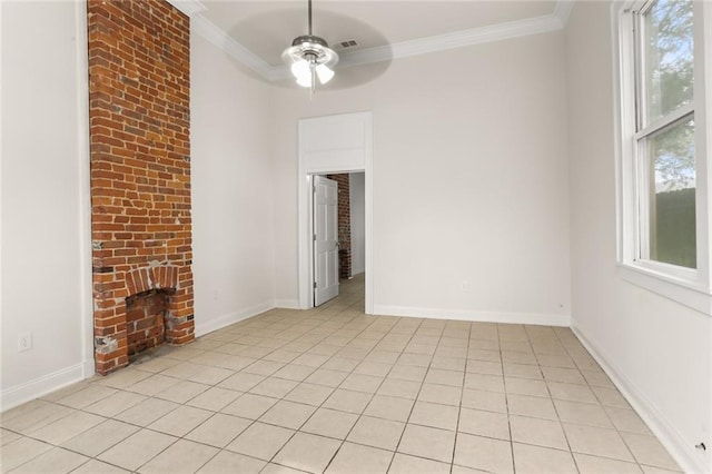 unfurnished room with ceiling fan, a fireplace, light tile patterned flooring, and ornamental molding