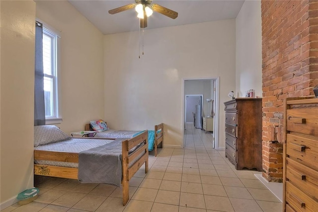 tiled bedroom with ceiling fan