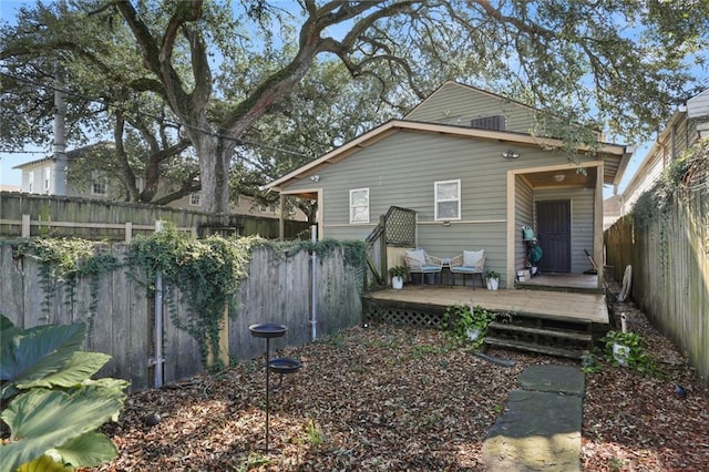 rear view of property with a deck