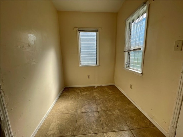 empty room featuring plenty of natural light