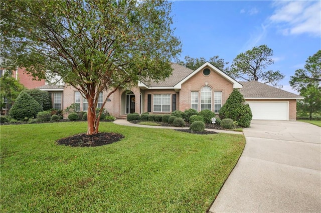 view of front facade with a garage and a front lawn