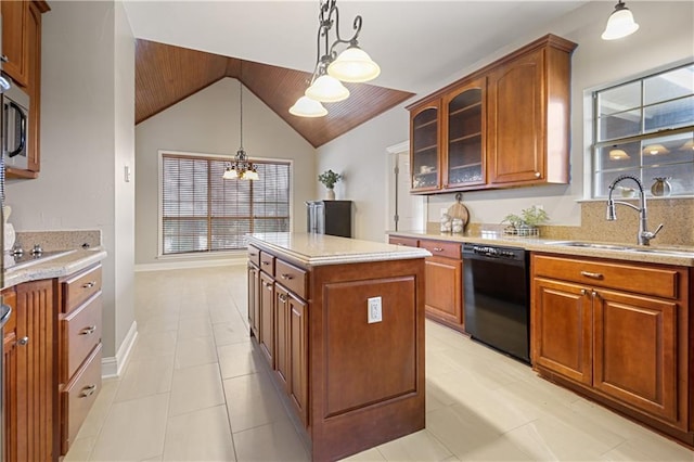 kitchen featuring vaulted ceiling, sink, black appliances, a chandelier, and a center island