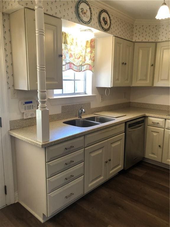 kitchen featuring crown molding, dark wood-style flooring, light countertops, and dishwasher