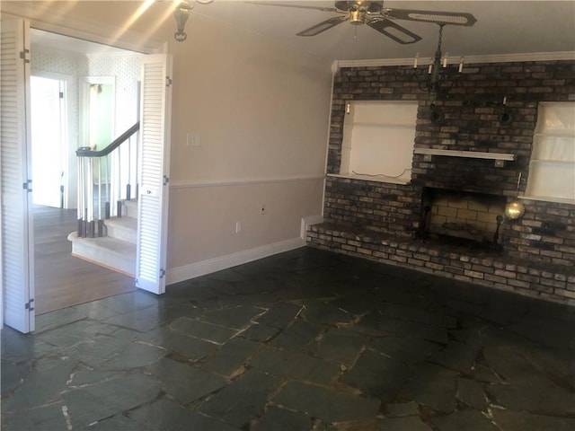 unfurnished living room with baseboards, a ceiling fan, marble finish floor, stairs, and crown molding