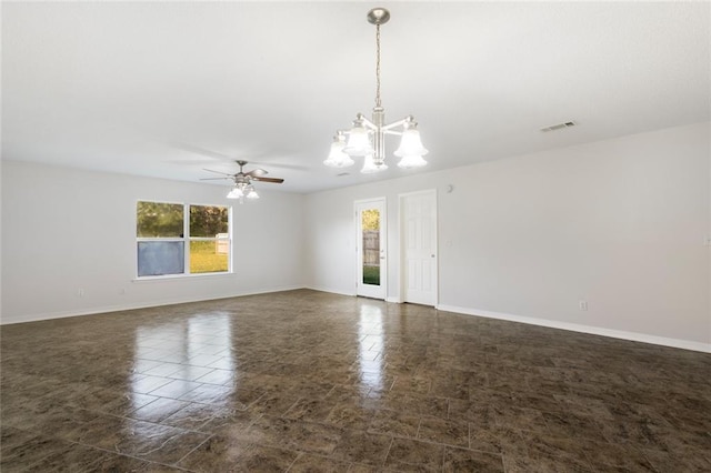 empty room with ceiling fan with notable chandelier