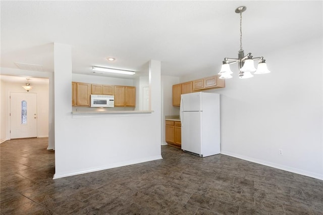 kitchen with light brown cabinets, white appliances, pendant lighting, and a notable chandelier