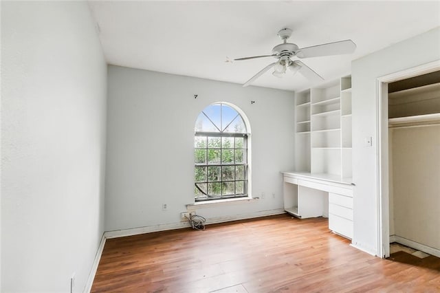 unfurnished bedroom featuring ceiling fan and light wood-type flooring