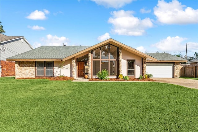 ranch-style home featuring a garage and a front yard