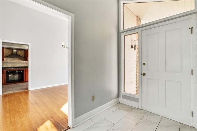 entryway with light hardwood / wood-style flooring