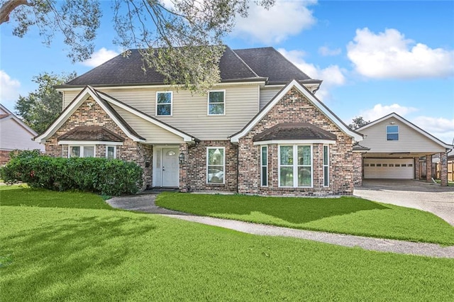 view of front of home featuring a front yard and a garage