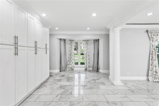 entryway with ornate columns and ornamental molding