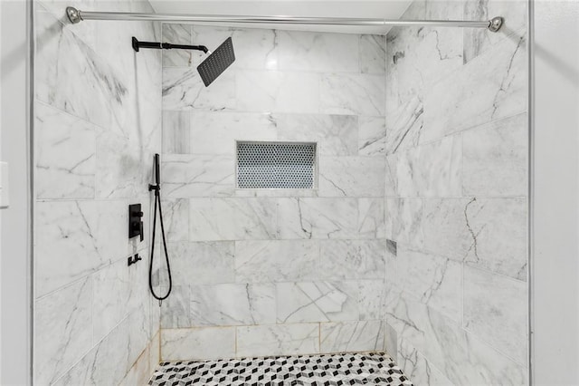 bathroom with tiled shower