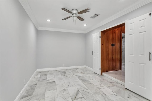 spare room with ceiling fan and crown molding