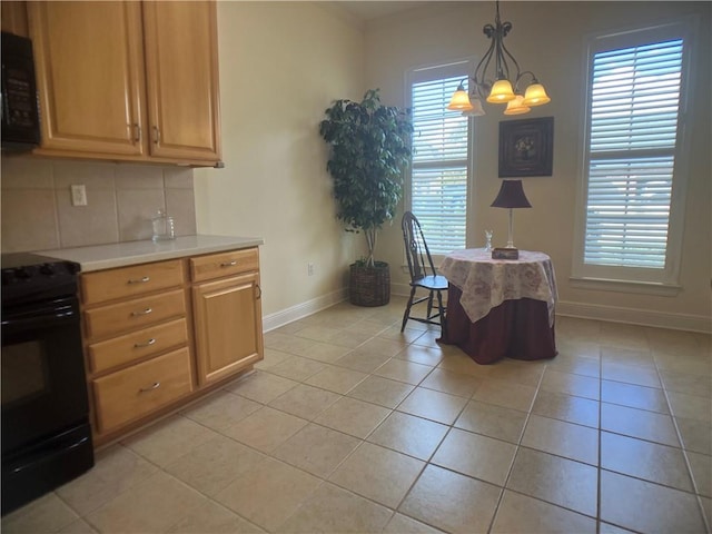 kitchen with black appliances, decorative backsplash, light tile patterned floors, decorative light fixtures, and a chandelier