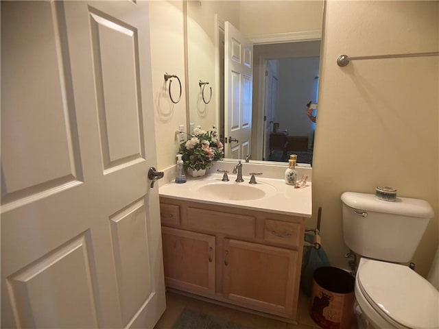 bathroom with vanity and toilet