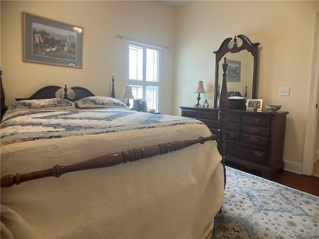 bedroom featuring dark hardwood / wood-style flooring