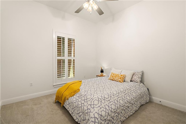 bedroom featuring light colored carpet and ceiling fan