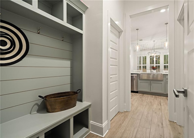 mudroom featuring light wood-type flooring and sink