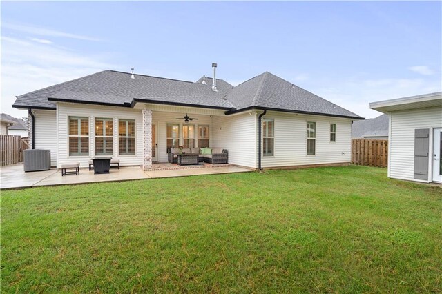 rear view of property with a lawn, outdoor lounge area, ceiling fan, central AC, and a patio area