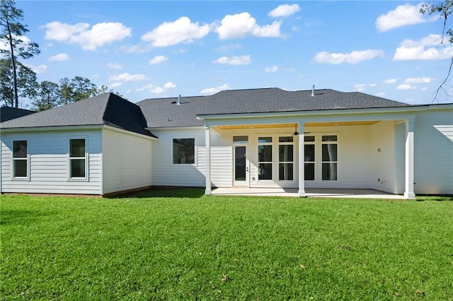 back of property featuring a patio area, ceiling fan, and a yard