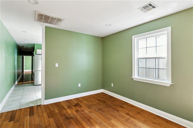 empty room with light wood-type flooring