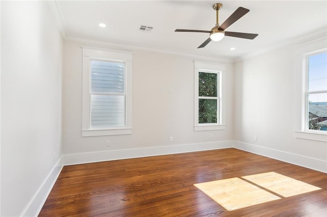 unfurnished room with hardwood / wood-style floors, ceiling fan, and crown molding