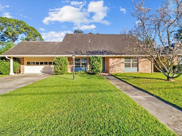 single story home featuring a garage and a front yard