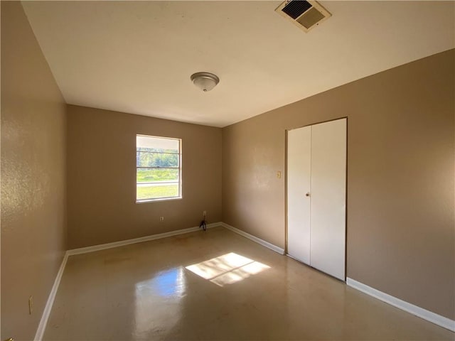 unfurnished bedroom with a closet