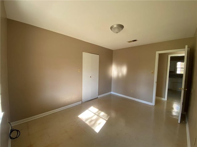 spare room with concrete floors