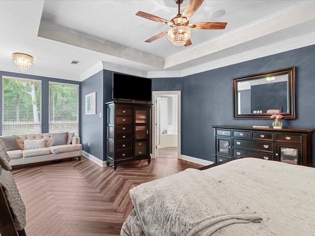 bedroom featuring ceiling fan, dark parquet flooring, crown molding, and a tray ceiling