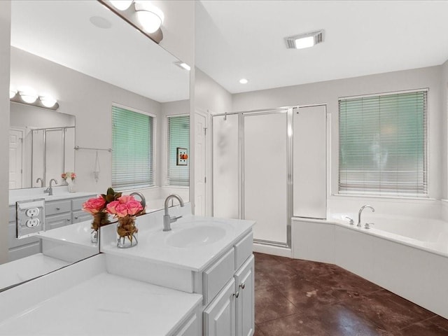 bathroom with tile patterned flooring, shower with separate bathtub, and vanity