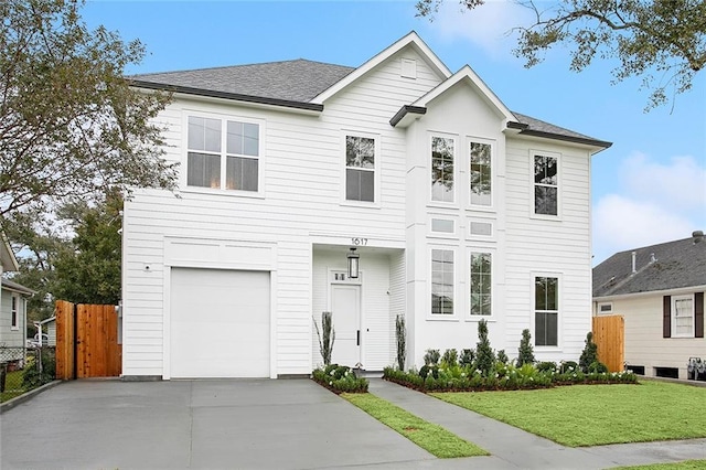 front facade with a front lawn and a garage