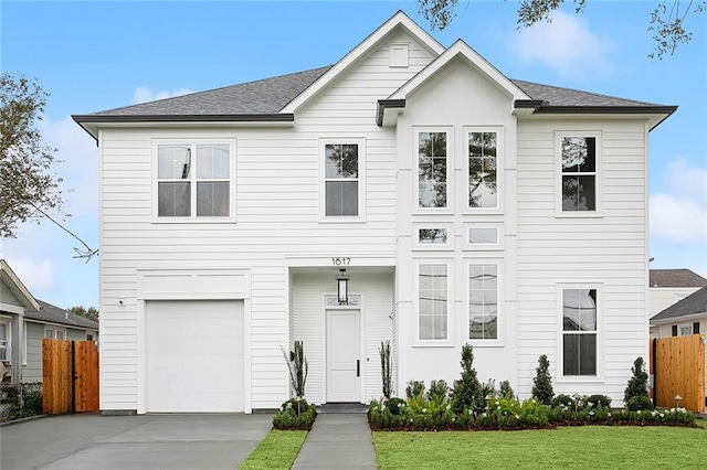 view of front of house featuring a front yard and a garage